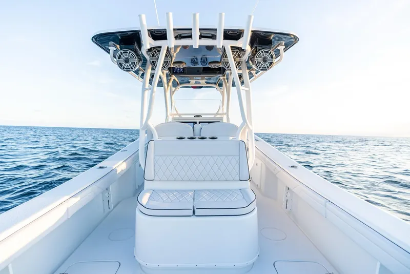 Slide: The Image of 2023 Yellowfin 34 boat on open water, featuring sleek design and spacious seating. - 22