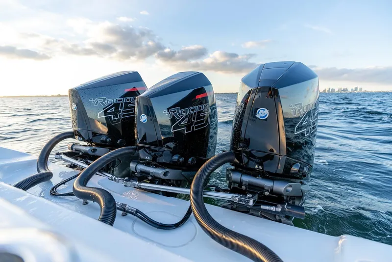 Slide: The Image of Triple outboard engines on a 2023 Yellowfin 34 boat in open water. - 28
