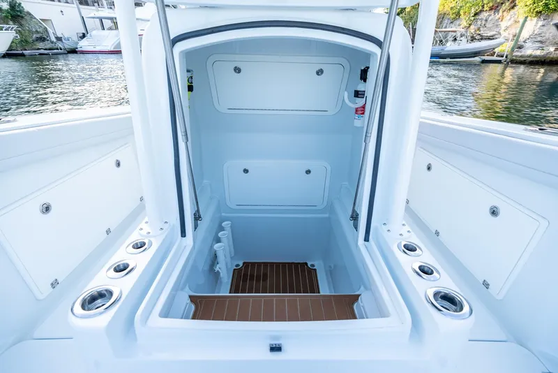 Slide: The Image of 2023 Yellowfin 34 boat interior with storage compartments and cup holders. - 34