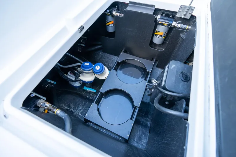 Slide: The Image of 2023 Yellowfin 34 boat engine compartment with filters and hoses. - 36