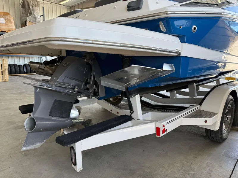Slide: The Image of 2017 Regal 2300 RX Surf boat on trailer, showcasing rear view and propeller. - 4