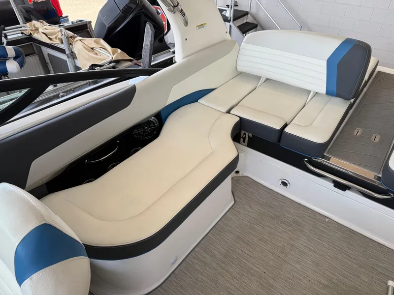 Slide: The Image of 2017 Regal 2300 RX Surf boat interior with white and blue seating. - 6
