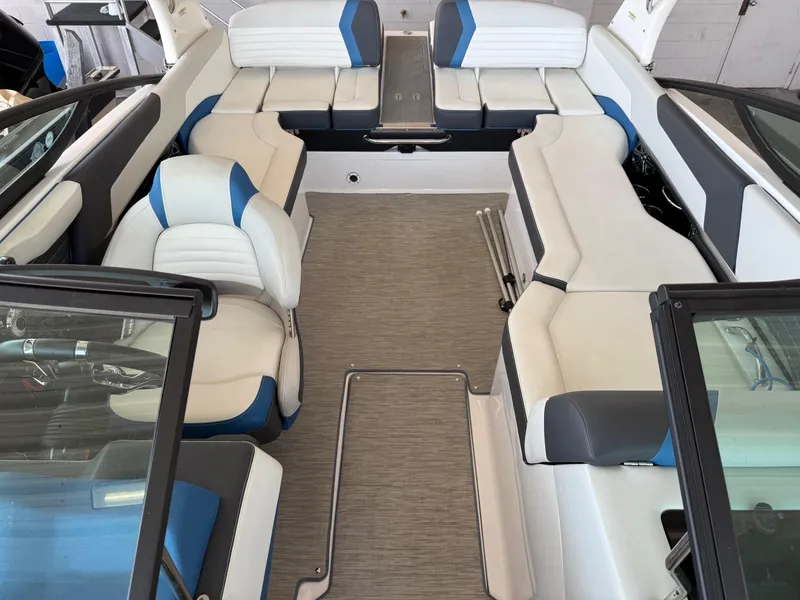 Slide: The Image of 2017 Regal 2300 RX Surf boat interior with white and blue seating. - 7