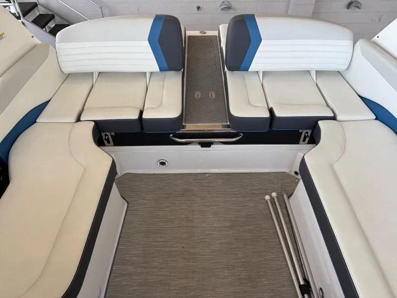 Slide: The Image of 2017 Regal 2300 RX Surf boat interior with white and blue seating. - 8