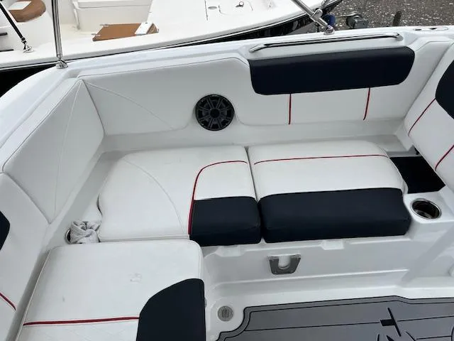 Slide: The Image of Luxurious seating in 2023 Tahoe 1950 boat with black and white upholstery. - 4