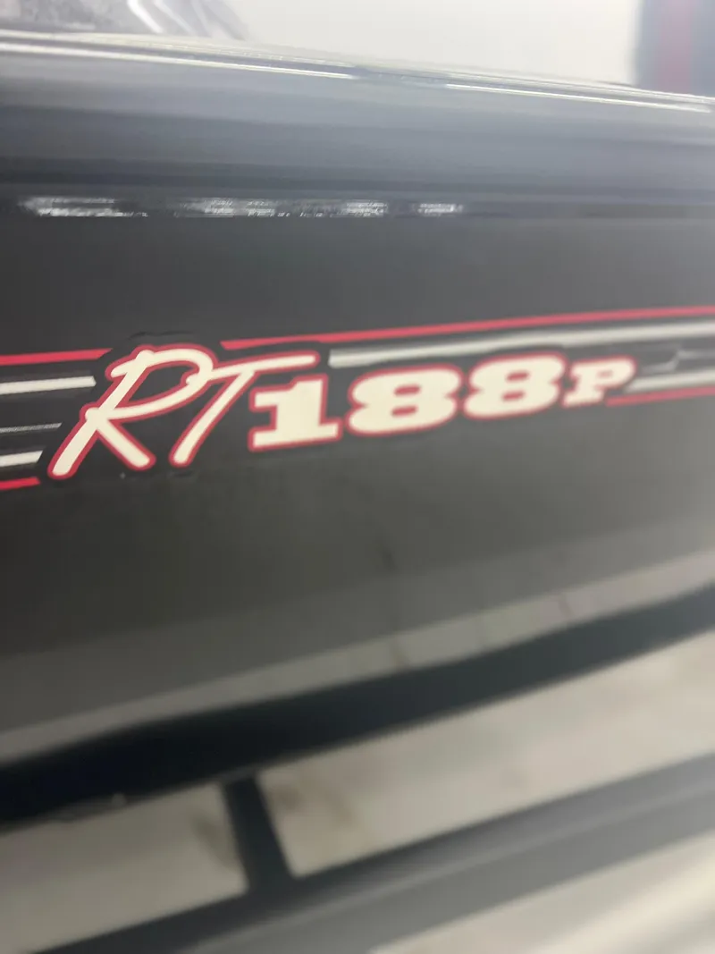 Slide: The Image of 2024 Ranger RT188P boat model logo in red and white on black surface. - 1