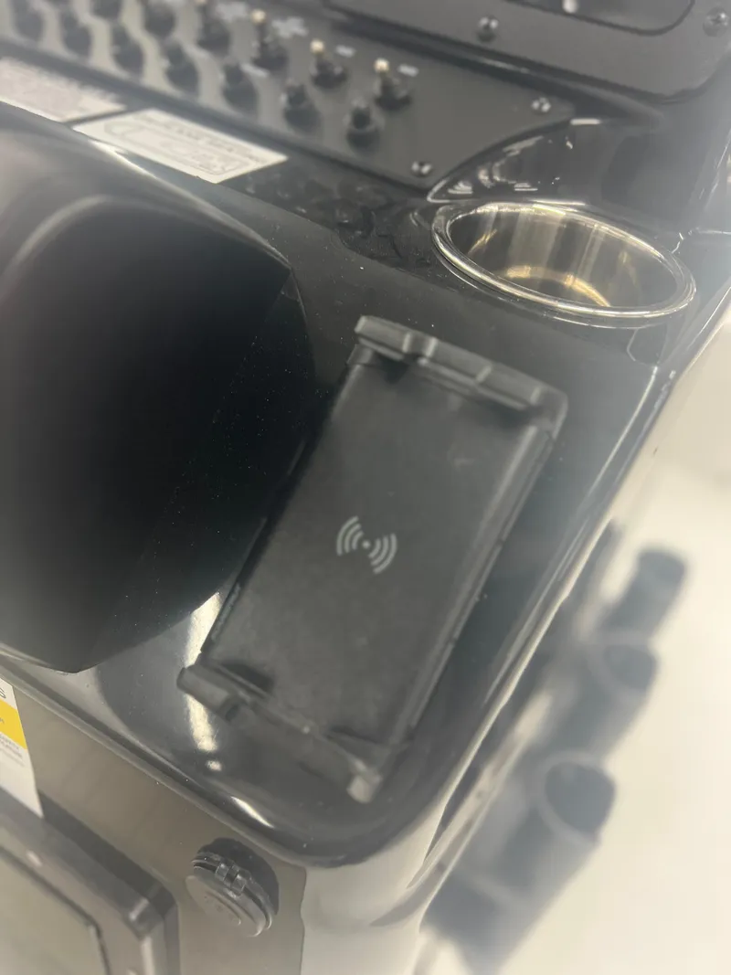 Slide: The Image of 2024 Ranger RT188P boat console with wireless charging pad and control panel. - 3