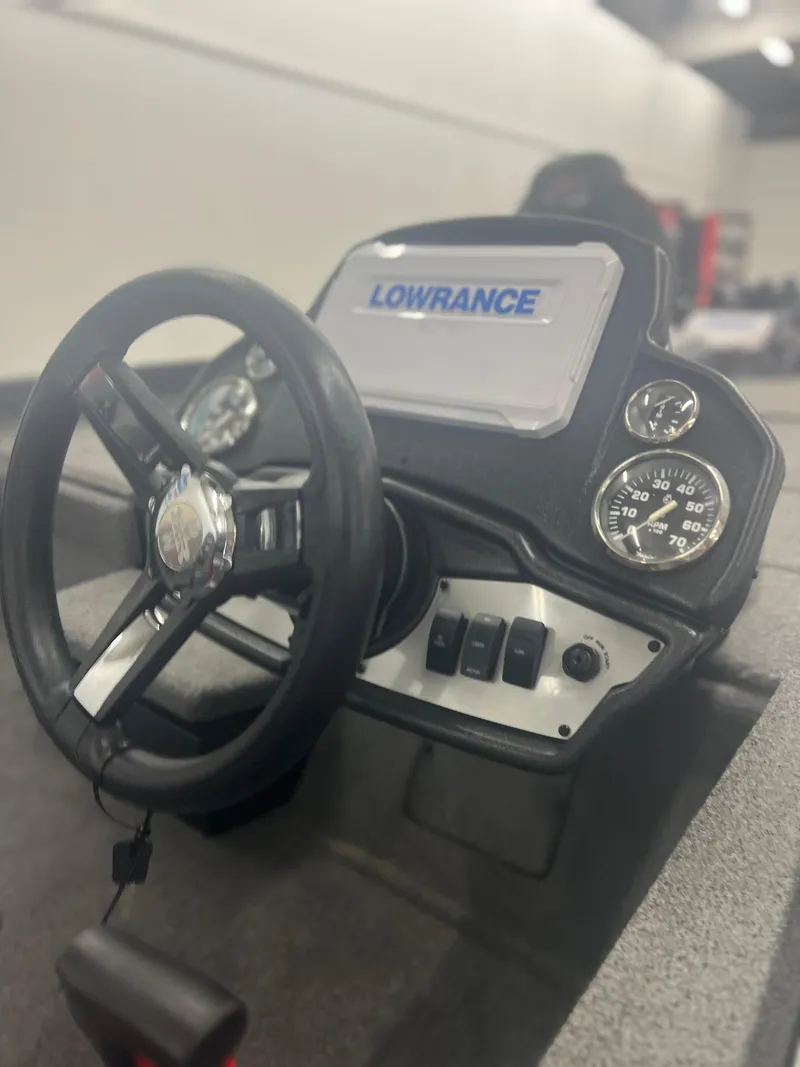 Slide: The Image of 2024 Ranger RT188P boat dashboard with Lowrance display and steering wheel. - 6
