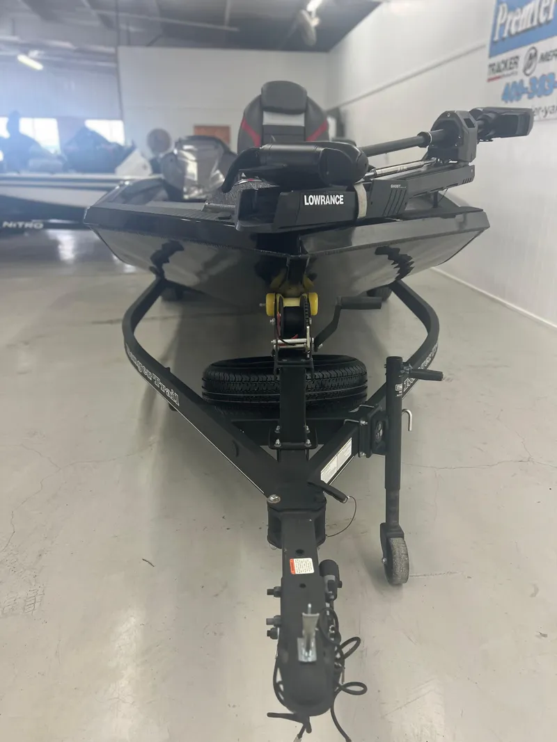 Slide: The Image of 2024 Ranger RT188P boat on trailer in showroom, featuring Lowrance equipment. - 9