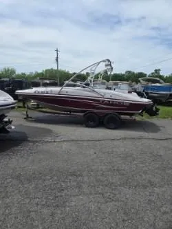 Slide: The Image of 2008 Tahoe 215 I/O boat on trailer in outdoor lot. - 9