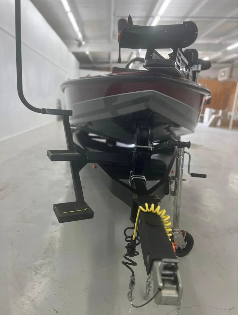 Slide: The Image of 2021 Vexus 2080 boat on trailer in a well-lit indoor space. - 12