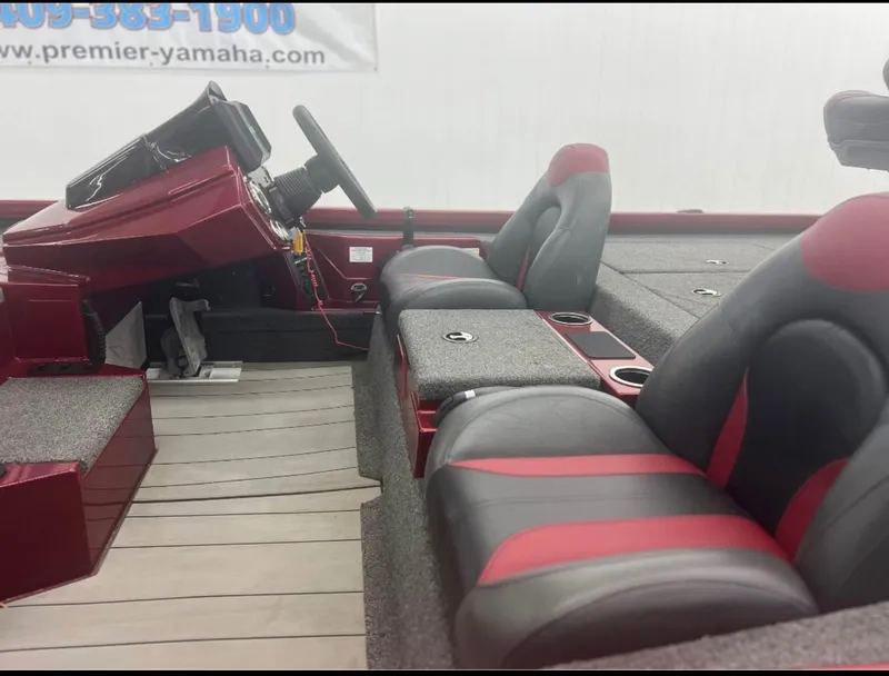 Slide: The Image of 2021 Vexus 2080 boat interior with red and black seats, steering wheel, and console. - 15