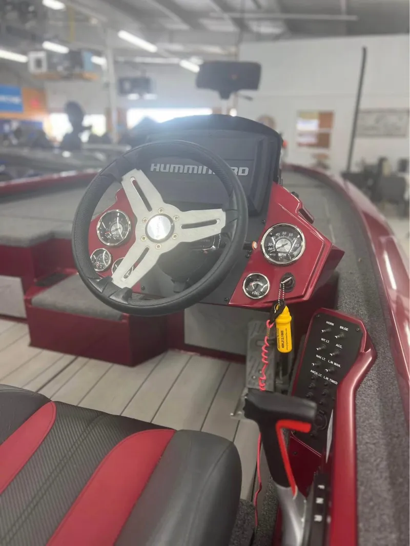 Slide: The Image of 2021 Vexus 2080 boat dashboard with steering wheel and Hummingbird display. - 6
