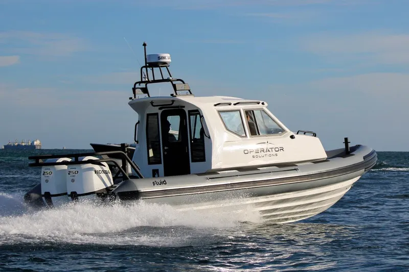 Slide: The Image of Fluid Watercraft Patrol 880 Cabin 2022 navigating ocean waters at high speed. - 1