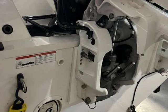 Slide: The Image of 2022 Fluid Watercraft Patrol 880 Cabin engine compartment, showcasing mechanical components and safety features. - 13