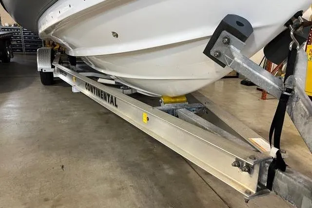 Slide: The Image of 2022 Fluid Watercraft Patrol 880 Cabin on Continental trailer in a garage. - 14