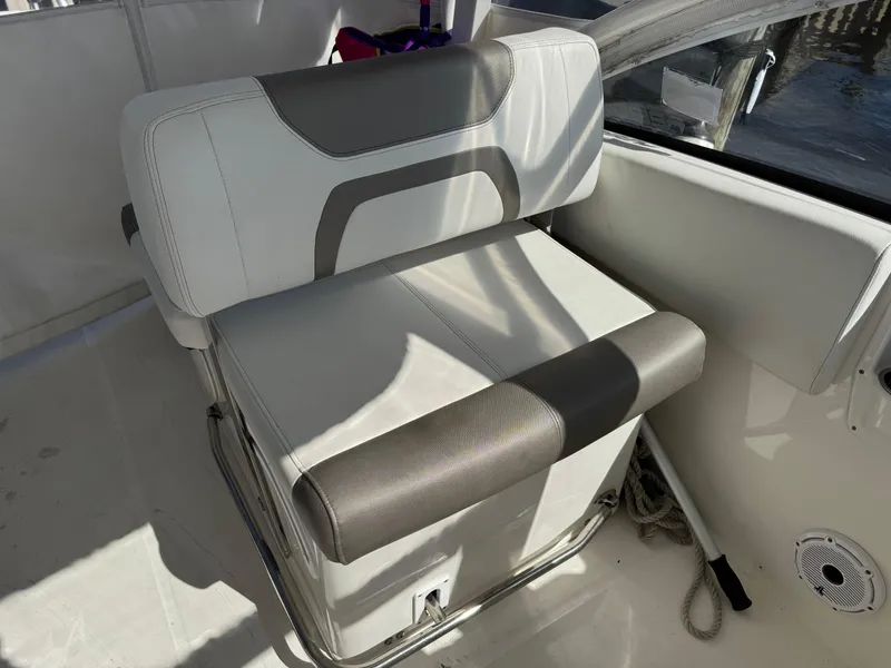 Slide: The Image of 2020 World Cat 280 DC-X boat seat with gray and white upholstery. - 13