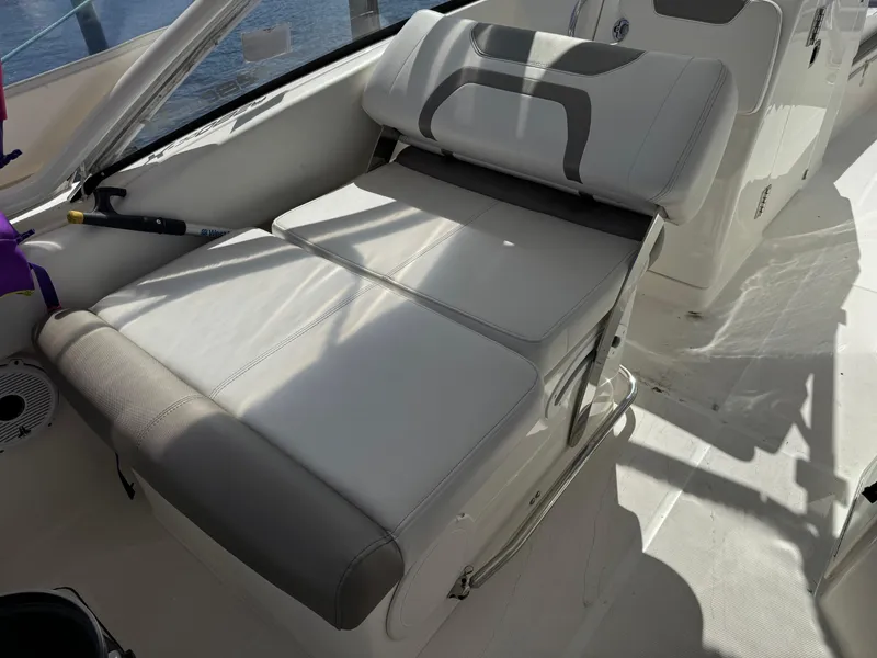 Slide: The Image of Luxury seating on 2020 World Cat 280 DC-X boat, featuring plush cushions and sleek design. - 15