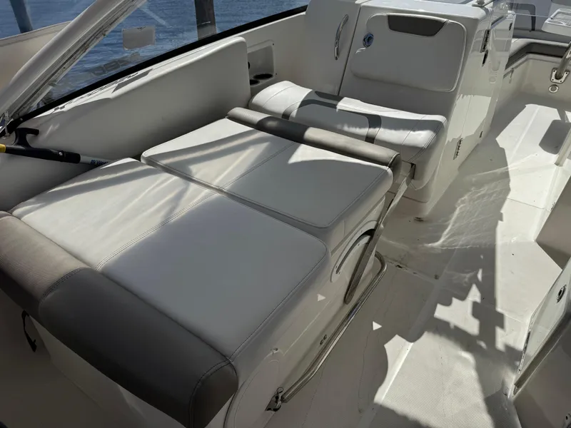 Slide: The Image of 2020 World Cat 280 DC-X boat interior with cushioned seating and sleek design. - 16