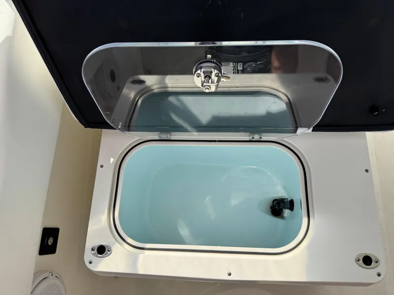 Slide: The Image of Livewell compartment on 2020 World Cat 280 DC-X boat, open lid, filled with water. - 17