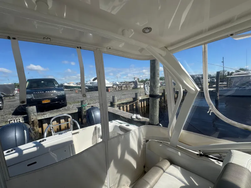 Slide: The Image of Interior view of 2020 World Cat 280 DC-X boat docked at marina. - 23