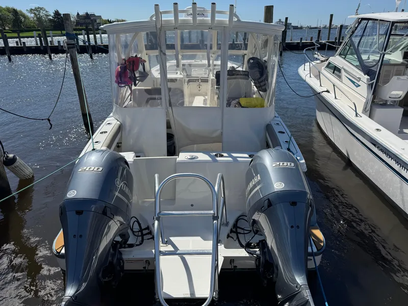 Slide: The Image of 2020 World Cat 280 DC-X boat with twin Yamaha 200 engines docked at marina. - 4