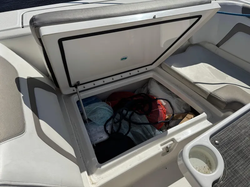 Slide: The Image of Storage compartment on a 2020 World Cat 280 DC-X boat, filled with gear. - 8
