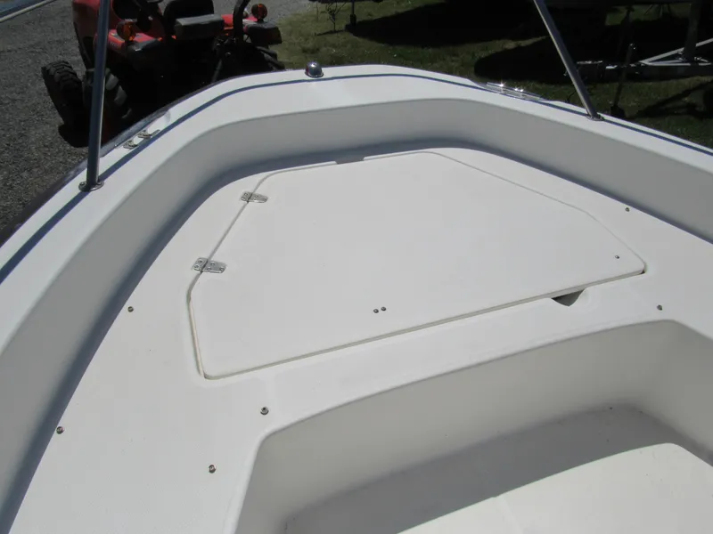 Slide: The Image of 2013 Boston Whaler 200 Dauntless boat deck with storage compartment. - 23