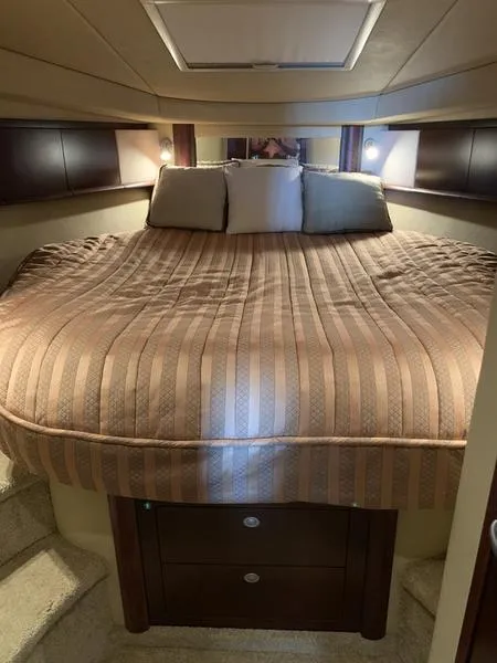 Slide: The Image of Luxurious cabin interior of a 2007 Sea Ray 40 Sundancer yacht with a cozy bed. - 11
