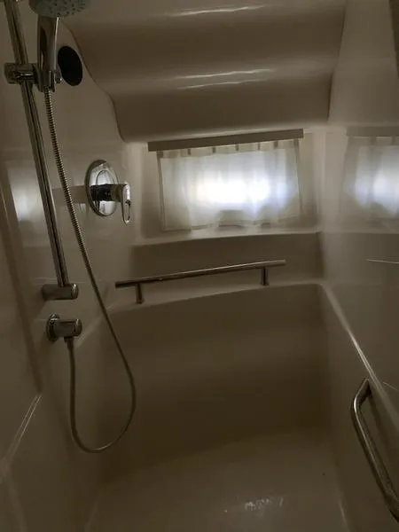 Slide: The Image of Shower area in 2007 Sea Ray 40 Sundancer yacht with window and curtain. - 13