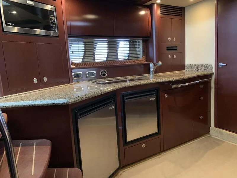 Slide: The Image of Luxurious kitchen interior of 2007 Sea Ray 40 Sundancer yacht with modern appliances. - 14