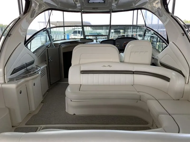 Slide: The Image of 2007 Sea Ray 40 Sundancer interior with white leather seating and modern design. - 15