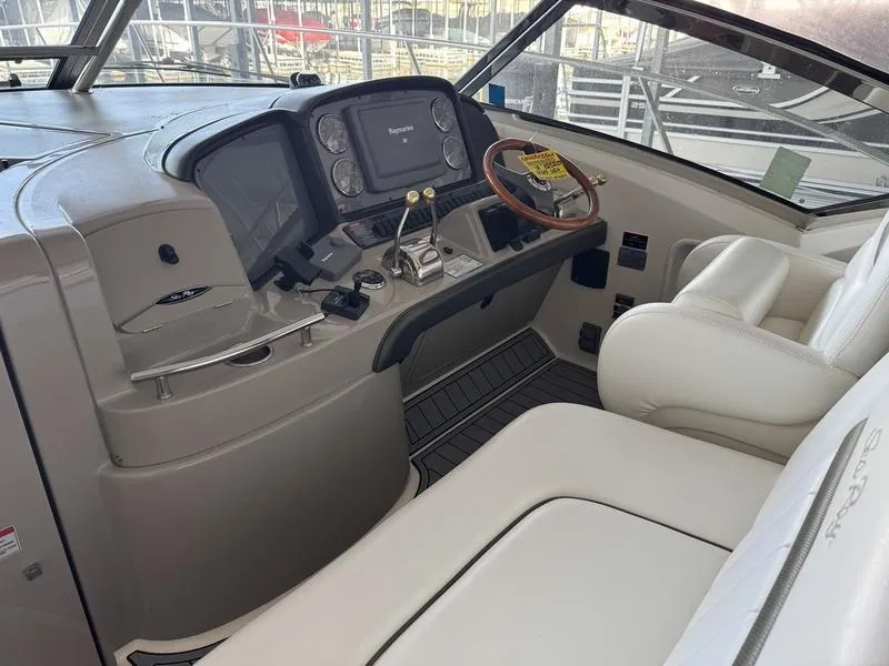 Slide: The Image of 2007 Sea Ray 40 Sundancer helm with modern controls and comfortable seating. - 19