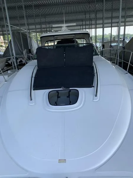 Slide: The Image of 2007 Sea Ray 40 Sundancer yacht with sunpad, docked under a covered marina. - 21