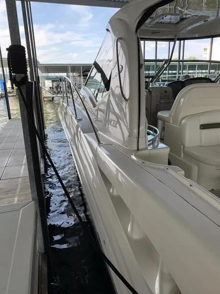 Slide: The Image of 2007 Sea Ray 40 Sundancer docked, showcasing sleek design and spacious interior. - 24