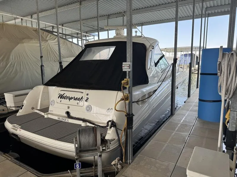 Slide: The Image of 2007 Sea Ray 40 Sundancer docked in a covered marina slip. - 5