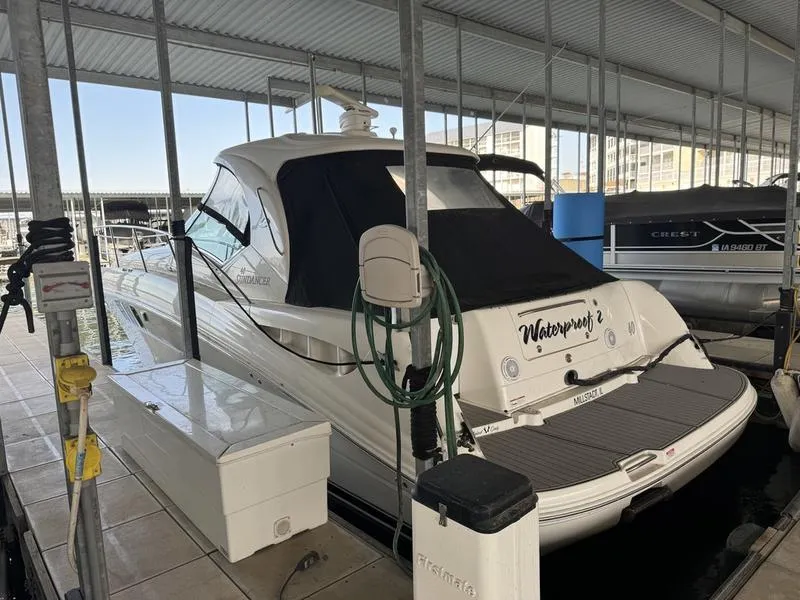 Slide: The Image of 2007 Sea Ray 40 Sundancer docked in a covered marina slip. - 6