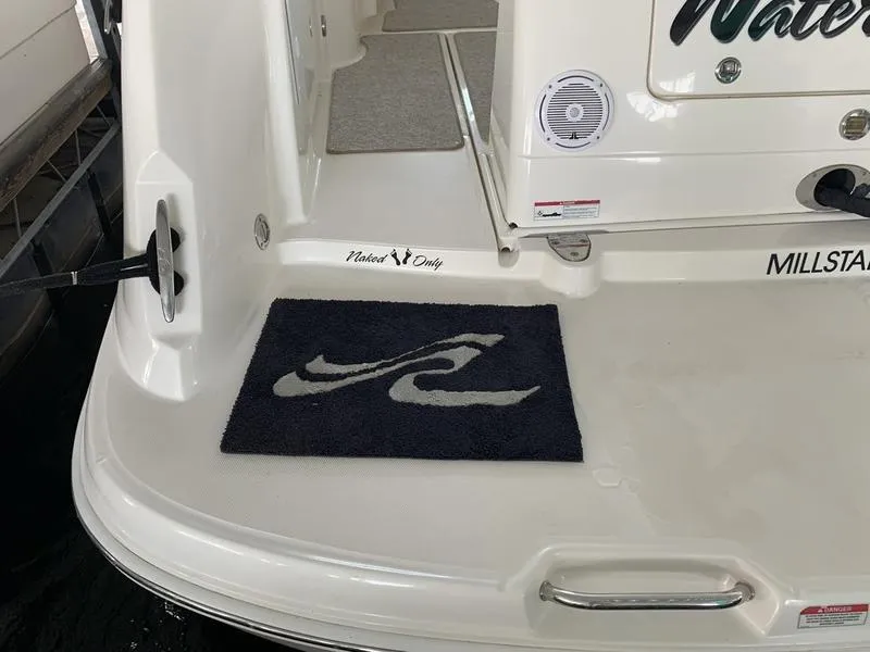 Slide: The Image of 2007 Sea Ray 40 Sundancer boat deck with logo mat and speaker. - 8