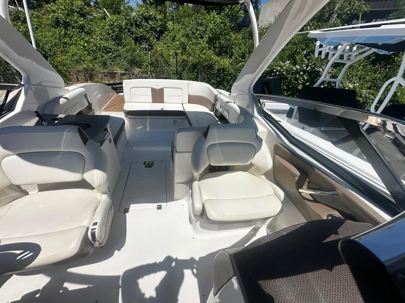 Slide: The Image of 2014 Chaparral 307 SSX boat interior with white seating and modern design. - 15