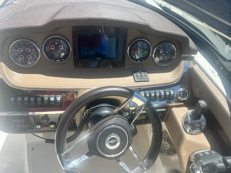 Slide: The Image of 2014 Chaparral 307 SSX dashboard with steering wheel, gauges, and control panel. - 20