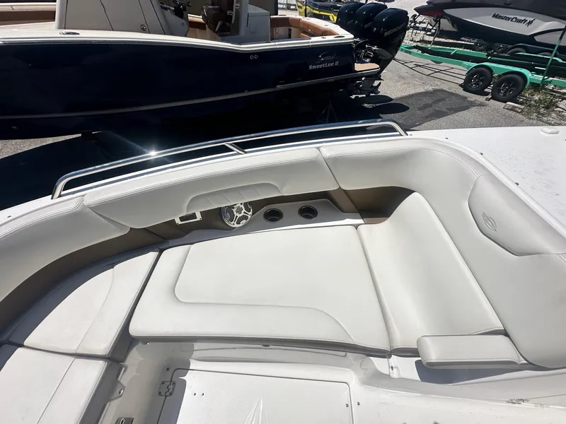 Slide: The Image of 2014 Chaparral 307 SSX boat with spacious white seating area. - 35