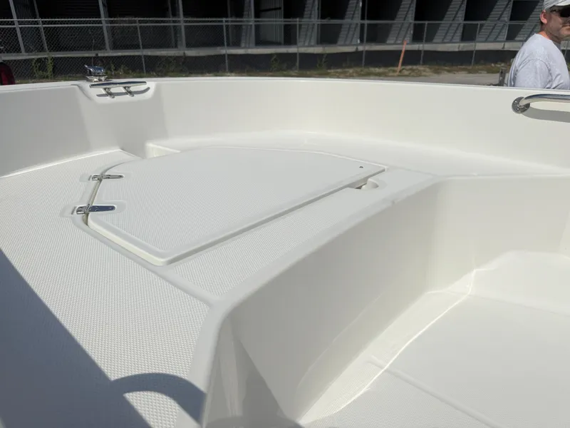 Slide: The Image of 2023 Boston Whaler 160 Super Sport boat interior with storage compartment. - 18