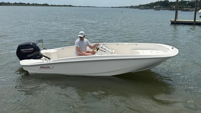 Slide: The Image of 2023 Boston Whaler 160 Super Sport boat on water with Mercury engine. - 3