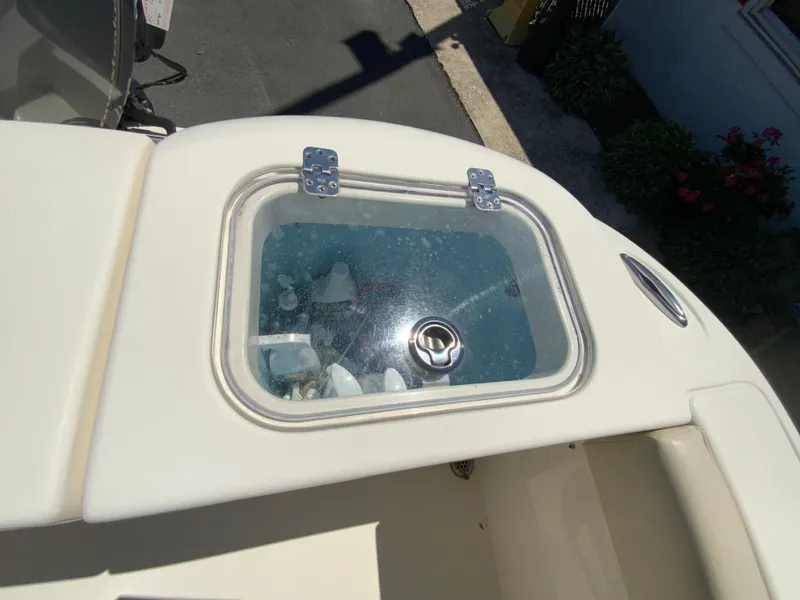 Slide: The Image of 2019 Cobia 220 Center Console boat with a clear livewell lid. - 15