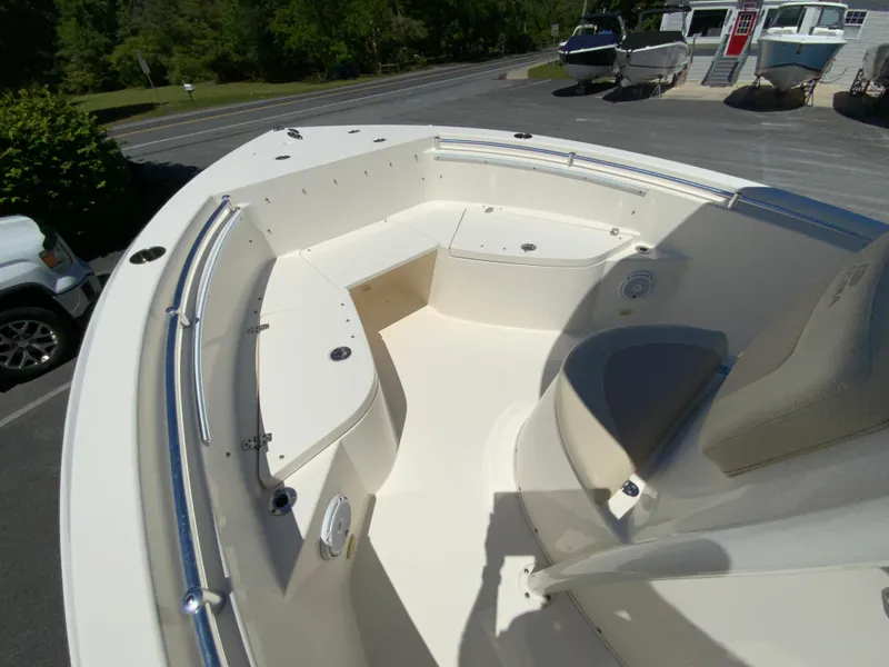 Slide: The Image of 2019 Cobia 220 Center Console boat with spacious seating and sleek design. - 17