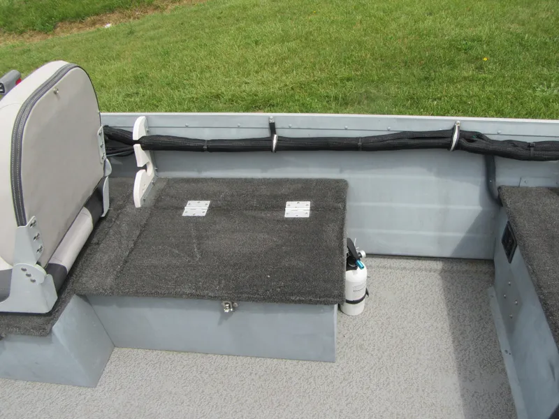 Slide: The Image of 2018 Starcraft SF DLX 16 boat interior with seating and storage compartments. - 13