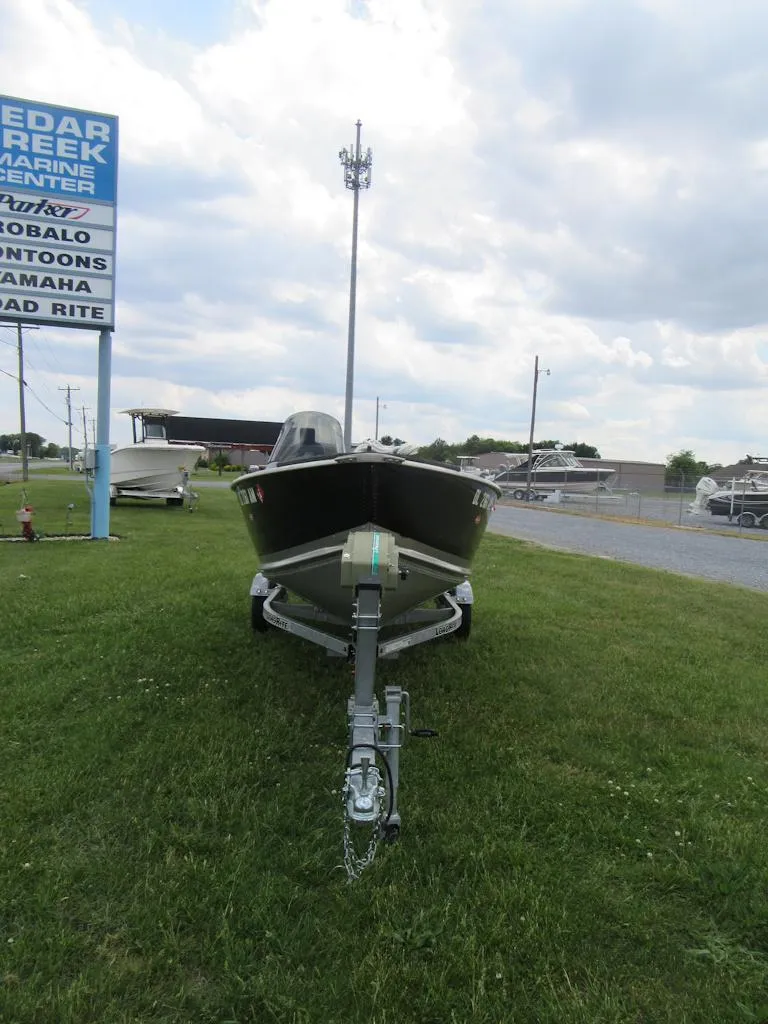 Slide: The Image of 2018 Starcraft SF DLX 16 boat on trailer at Cedar Creek Marine Center. - 2