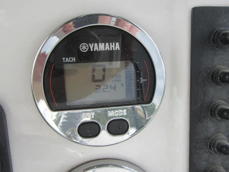 Slide: The Image of Yamaha tachometer on 2018 Starcraft SF DLX 16 boat dashboard, displaying 0 RPM. - 23