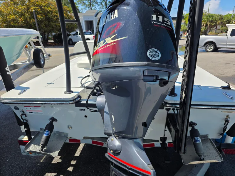 Slide: The Image of 2024 Hewes Redfisher 18 boat with Yamaha 115 engine, rear view. - 5