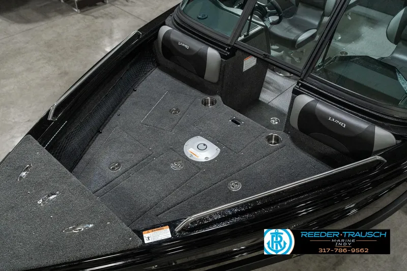 Slide: The Image of 2025 Lund 1975 Tyee boat interior with seating and storage compartments. - 11